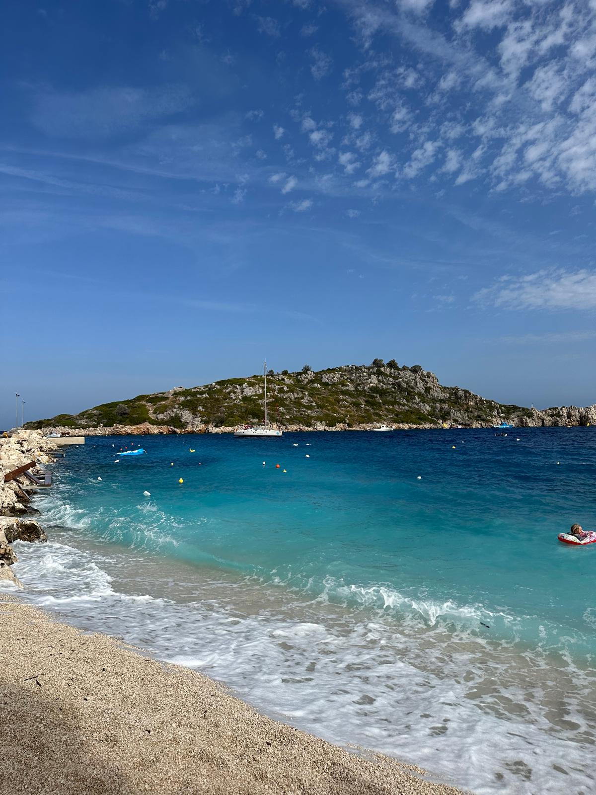 Turquoise bay with rocky island