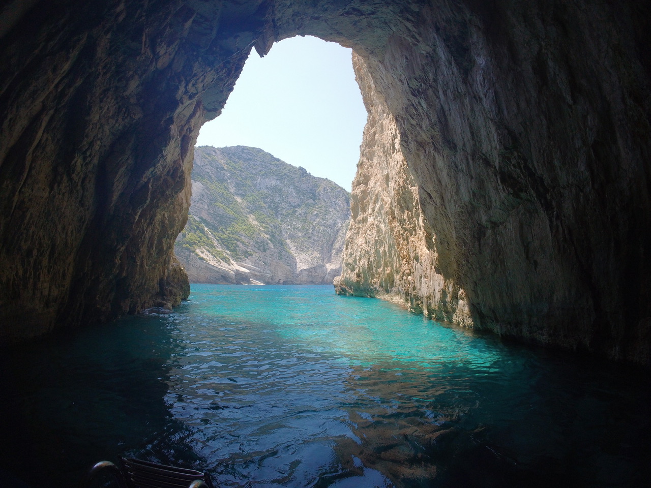 Inside the Blue Caves looking out through the cave arch to turquoise water